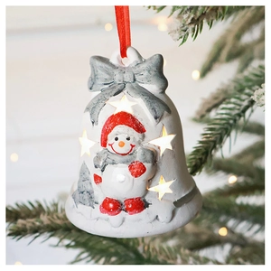 Illuminated white Christmas bell ornament with snowman motif hanging on a festive tree
