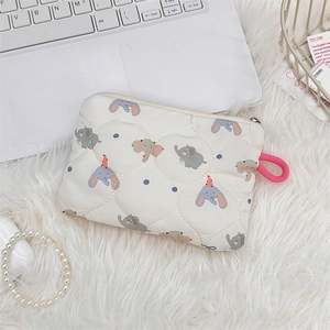 Detailed view of quilted makeup pouch with cartoon elephant pattern and zipper