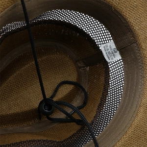 Detail view of the interior lining, size 58 label, and windproof rope of the straw jazz hat