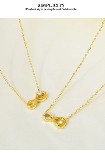 Detail shot of gold infinity necklace with cubic zirconia accents on textured fabric
