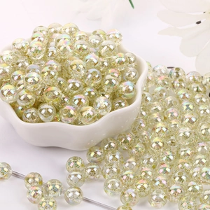 Macro detail of 8mm acrylic beads with glitter and iridescent finish for DIY jewelry