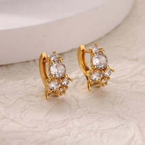 Minimalist gold huggie hoop earrings with sparkling cubic zirconia cluster inlay
