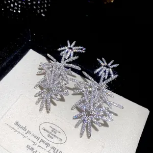 Sparkling silver starburst earrings with zircons for women, luxury firework design
