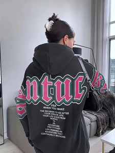 Back view of a black oversized hoodie featuring Kentucky USA pink and green graphic print