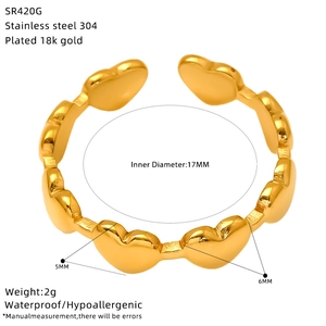 Detail view of 18K gold plated stainless steel ring with linked heart design