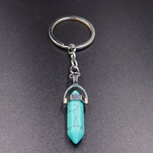 Detailed view of turquoise hexagonal crystal pendant with silver alloy keychain ring