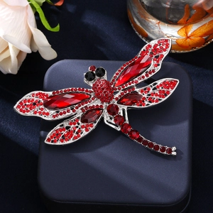Elegant vintage dragonfly brooch with red and black crystals on a silver alloy base