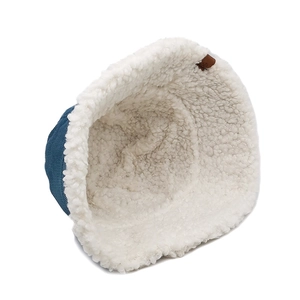 Blue corduroy bucket hat with thick white faux shearling lining and warm double-layer design