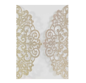 Detail of champagne gold glitter laser-cut wedding invitation with floral scroll patterns
