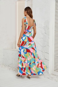 Detail view of vibrant graffiti print and waist-tie on bohemian summer maxi dress