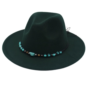 Detail of western fedora hat with turquoise beads and ethnic style cord trim