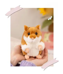 Close-up of cute plush hamster toy in a hand showing soft texture and round shape