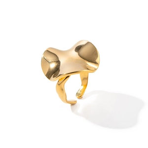 Detail showing high-polished wavy surface and adjustable band of the 18k gold ring