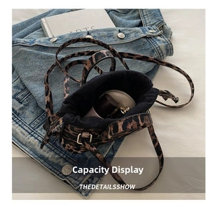 Detail shot of leopard print mini drawstring bag showing interior capacity for makeup items
