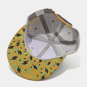 Hip hop snapback hat featuring yellow leopard print and black lightning embroidery