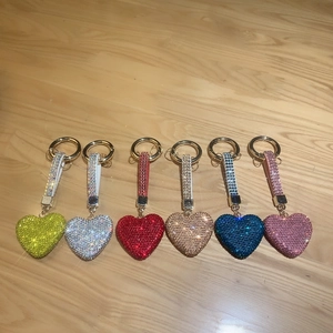 Detailed view of colorful heart keychains with sparkling rhinestones in six vibrant colors