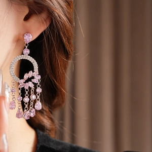 Close-up of pink zircon drop fringe earrings with French court style design for women