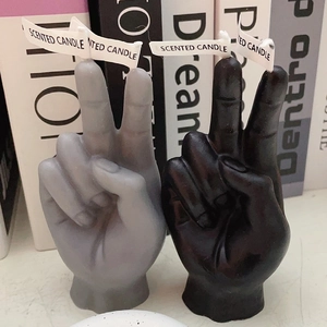 Victory gesture scented candles in black and grey colors for creative home decor