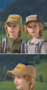 Detail view of quick-dry kids baseball hats with mountain embroidery and 5.5cm brim