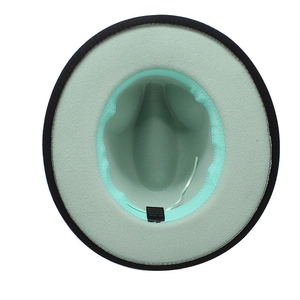 Detail view of contrast interior with mint green lining and adjustable sweatband on wool fedora