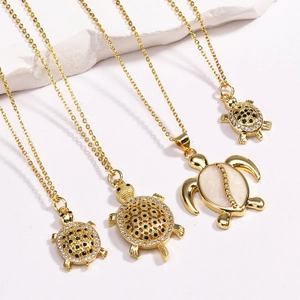 Elegant gold sea turtle pendant necklaces with mother of pearl and crystal inlay