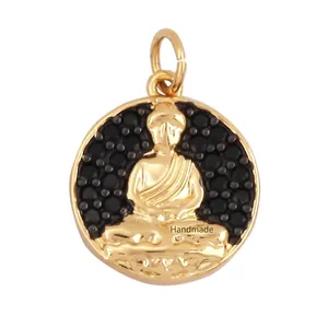 Detailed view of a gold-plated Buddha pendant featuring black cubic zirconia pavé