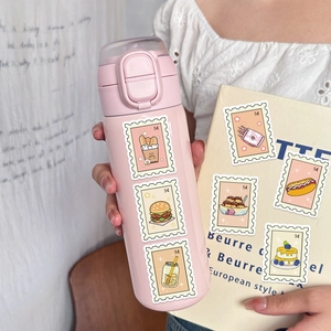 Close-up of cute food stickers on a pink water bottle held by hand for DIY decoration