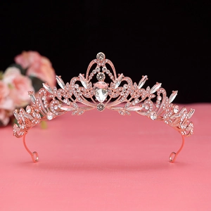 Close-up of rose gold bridal crown featuring intricate floral rhinestone and zircon details