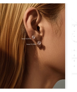 Detailed comparison of 5mm and 6mm round cubic zirconia stud earrings in sterling silver