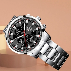 Detailed macro view of the black chronograph dial with calendar and tachymeter bezel