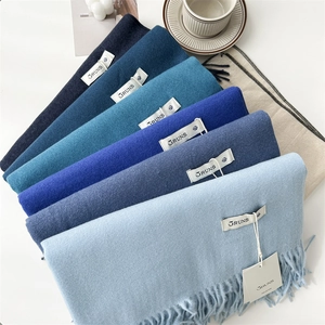 Soft solid color cashmere feel scarves with tassels in blue and beige gradients