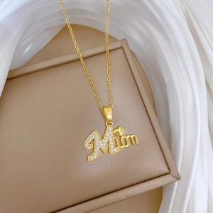 Gold Mom pendant necklace with crystals and heart on brown leather display box