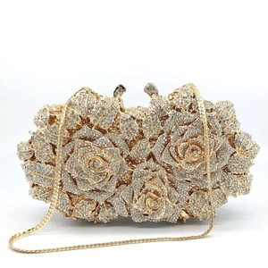 Luxurious gold rose shaped evening clutch bag with sparkling rhinestones and chain strap