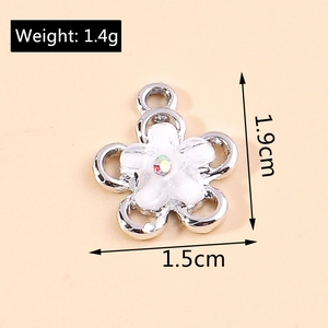 Detailed view of flower pendant size and weight showing 1.9cm length and silver plating