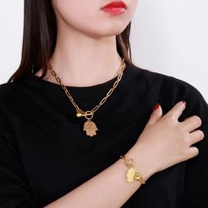 Golden Hamsa hand paperclip chain necklace and bracelet set with OT toggle clasp