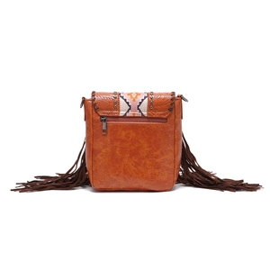 Detail of bohemian leather crossbody bag with floral embossing and colorful woven panels