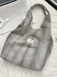 Chic tie-dye grey quilted puffer tote bag with canvas straps and interior label detail