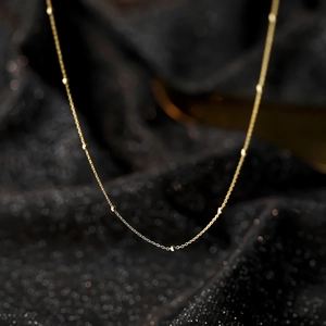 Elegant s925 silver beaded necklace in gold finish with delicate round beads