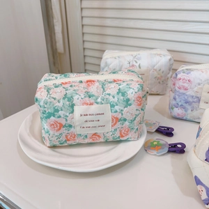 French floral quilted cotton cosmetic bag on ceramic plate with elegant French script label