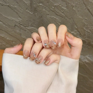 Handmade leopard press-on nails with brown gradient, gold glitter, and rhinestones