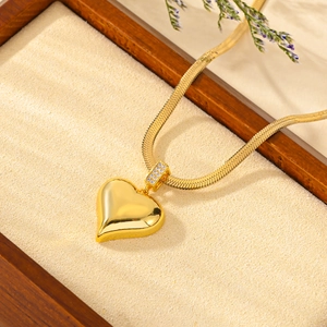 Golden flat snake chain necklace featuring a 3D heart pendant with sparkling pavé zircons