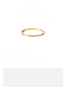 Detail showing 57.8mm inner diameter and 12.5g weight of gold titanium steel bangle