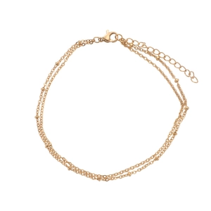 Double-layered gold bead chain bracelet with lobster clasp and extension chain on white