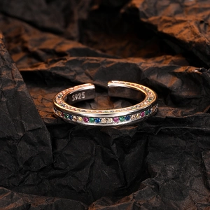 S925 sterling silver open ring with rainbow zircon gemstones on dark paper