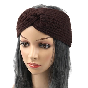 Close-up of dark brown knitted headband with fleece lining and cross twist design