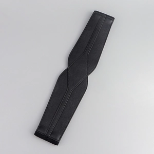 Detailed view of black leather waist belt texture and high-quality stitching craftsmanship