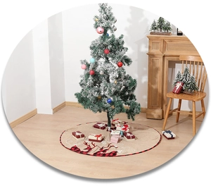 Detail of linen Christmas tree skirt featuring reindeer silhouette and red plaid borders