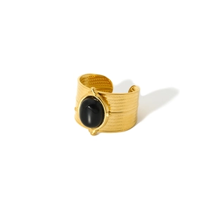 Detailed macro view of retro 18k gold plated ring with a large oval black natural stone