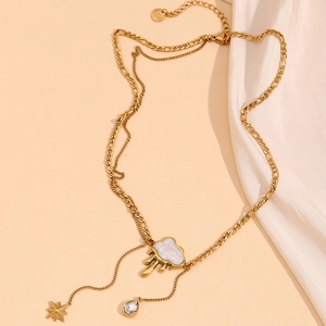 Detail of 18K gold plated double layer necklace with melting cloud and star charms