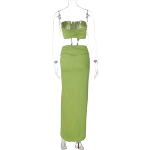 Back view of grass green two-piece set featuring ruched tube top and long slit skirt
